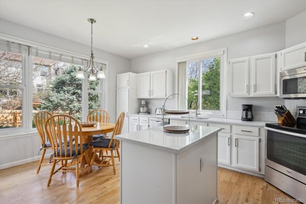 Dining room, Interior, Kitchen, Pendant Lights, Recessed Lighting, Stainless Steel Appliances, Wood Texture Flooring