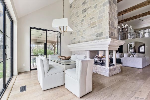 Chandelier, Dining room, Fireplace, Interior, Living room, Pendant Lights, Stone Walls, Wood Texture Flooring