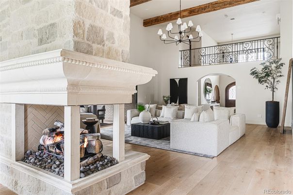 Chandelier, Fireplace, Interior, Living room, Recessed Lighting, Stone Walls, Wooden Beams, Wood Texture Flooring
