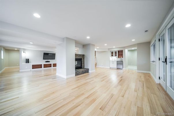 Empty room, Fireplace, Interior, Kitchen, Recessed Lighting, Wood Texture Flooring