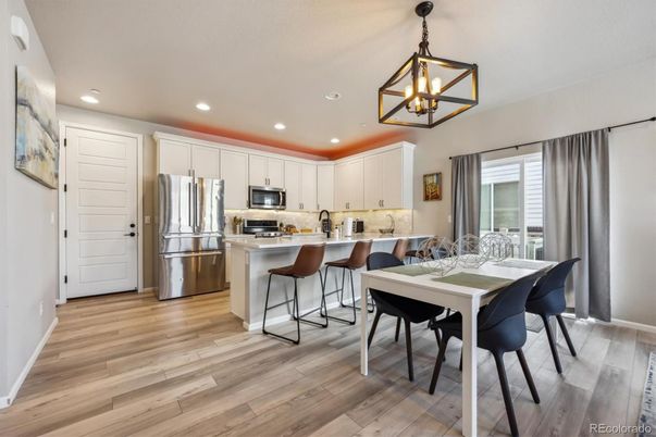Dining room, Interior, Kitchen, Pendant Lights, Recessed Lighting, Stainless Steel Appliances, Wood Texture Flooring