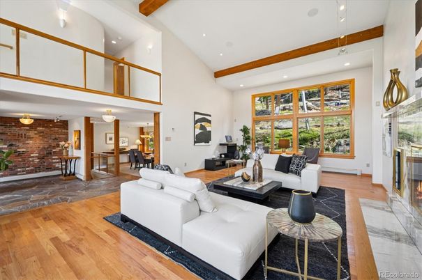 Dining room, Fireplace, Interior, Living room, Recessed Lighting, Stone Walls, Wooden Beams, Wood Texture Flooring
