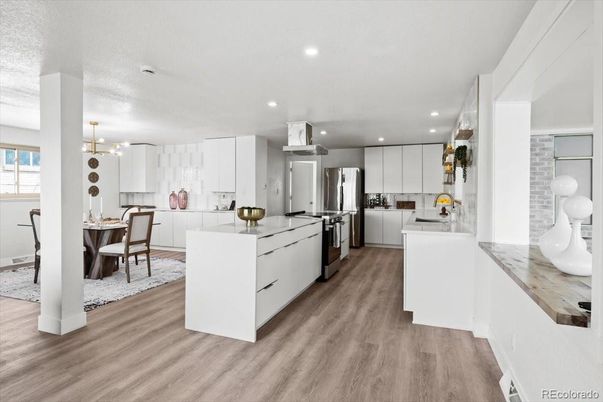 Dining room, Interior, Kitchen, Pendant Lights, Recessed Lighting, Stainless Steel Appliances, Wood Texture Flooring
