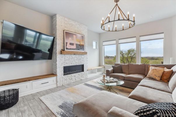 Chandelier, Fireplace, Interior, Living room, Stone Walls, Wood Texture Flooring