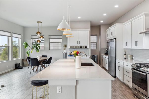 Dining room, Interior, Kitchen, Pendant Lights, Recessed Lighting, Stainless Steel Appliances, Wood Texture Flooring