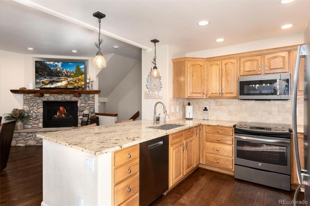 Fireplace, Interior, Kitchen, Pendant Lights, Recessed Lighting, Stainless Steel Appliances, Wood Texture Flooring