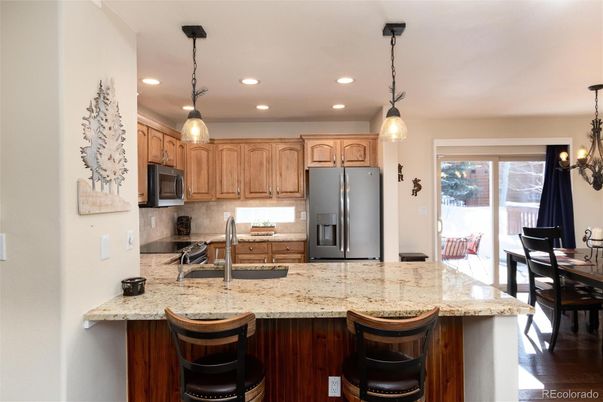 Dining room, Interior, Kitchen, Pendant Lights, Recessed Lighting, Stainless Steel Appliances, Wood Texture Flooring