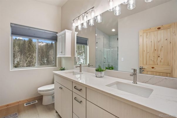 Bathroom, Dual Sink Vanities, Glass Shower, Interior, Marble Walls, Recessed Lighting