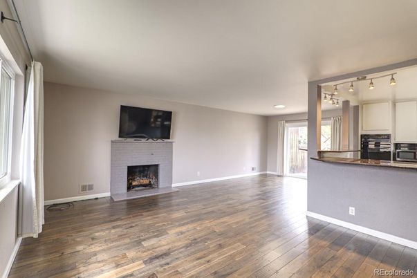 Empty room, Fireplace, Interior, Kitchen, Recessed Lighting, Wood Texture Flooring