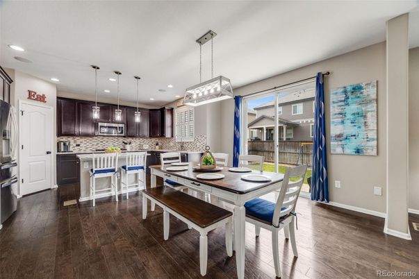 Dining room, Interior, Kitchen, Pendant Lights, Recessed Lighting, Stainless Steel Appliances, Wood Texture Flooring