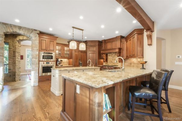 Interior, Kitchen, Pendant Lights, Recessed Lighting, Stainless Steel Appliances, Stone Walls, Wood Texture Flooring