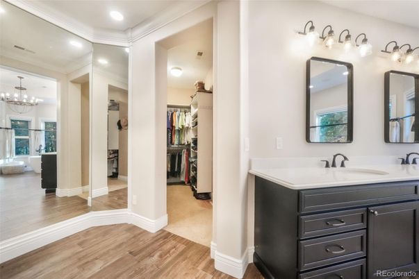 Bathroom, Chandelier, Dual Sink Vanities, Interior, Recessed Lighting, Walk-in Closets, Wood Texture Flooring