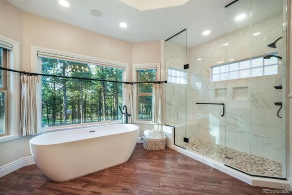 Bathroom, Free Standing Baths, Glass Shower, Interior, Marble Walls, Recessed Lighting, Wood Texture Flooring