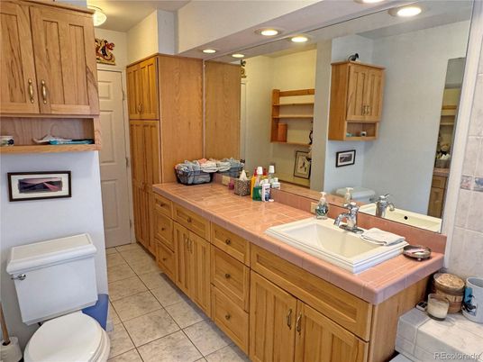 Bathroom, Dual Sink Vanities, Interior, Recessed Lighting, Tile Countertops