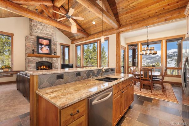 Dining room, Fireplace, Interior, Kitchen, Pendant Lights, Recessed Lighting, Stainless Steel Appliances, Stone Walls, Wooden Beams, Wooden Ceilings