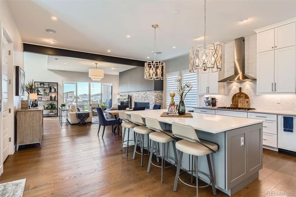 Chandelier, Dining room, Fireplace, Interior, Kitchen, Living room, Pendant Lights, Recessed Lighting, Stainless Steel Appliances, Wood Texture Flooring