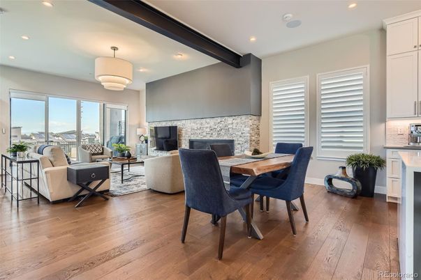 Dining room, Fireplace, Interior, Living room, Pendant Lights, Recessed Lighting, Stone Walls, Wood Texture Flooring