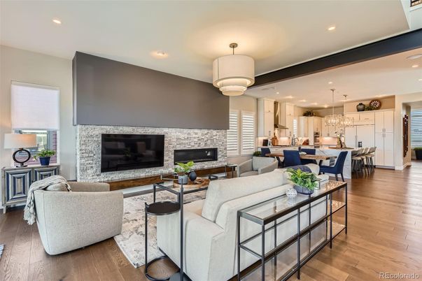 Chandelier, Dining room, Fireplace, Interior, Kitchen, Living room, Pendant Lights, Recessed Lighting, Stone Walls, Wood Texture Flooring