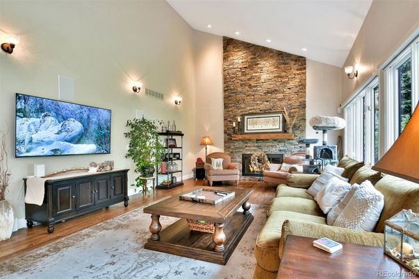 Fireplace, Interior, Living room, Recessed Lighting, Stone Walls, Wood Texture Flooring