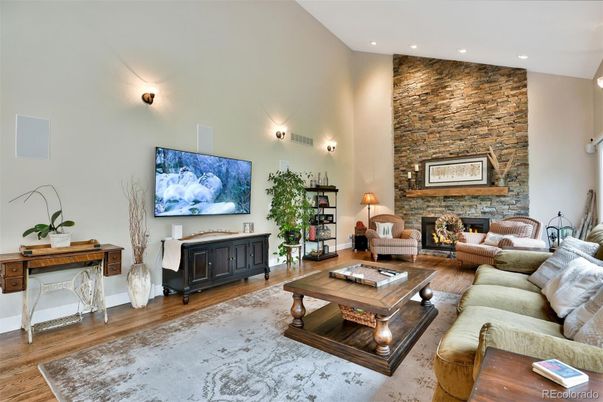 Fireplace, Interior, Living room, Recessed Lighting, Stone Walls, Wood Texture Flooring