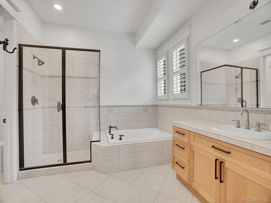 Bathroom, Dual Sink Vanities, Glass Shower, Interior, Recessed Lighting, Tile Countertops
