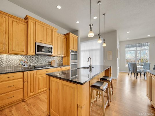 Dining room, Interior, Kitchen, Pendant Lights, Recessed Lighting, Stainless Steel Appliances, Wood Texture Flooring