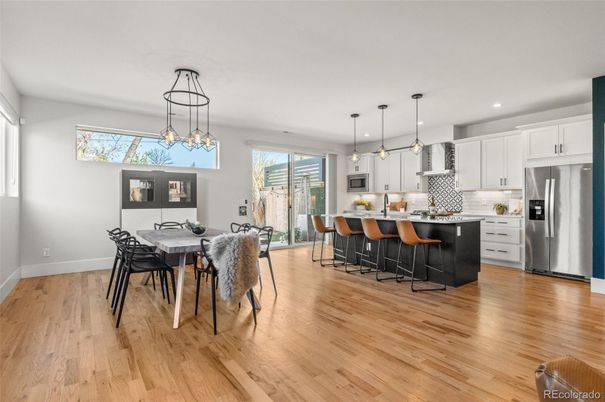 Dining room, Interior, Kitchen, Pendant Lights, Recessed Lighting, Stainless Steel Appliances, Wood Texture Flooring