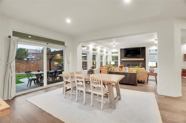 Dining room, Fireplace, Interior, Living room, Recessed Lighting, Wood Texture Flooring