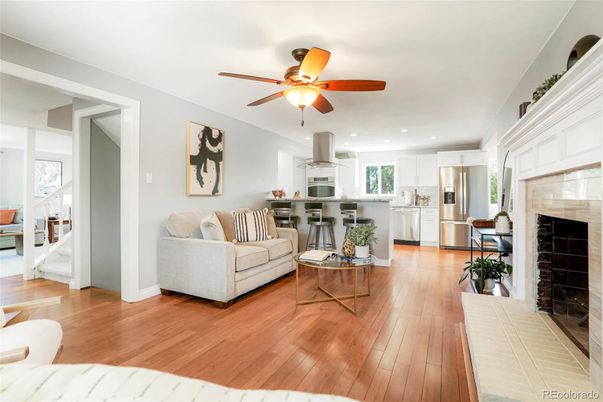 Fireplace, Interior, Kitchen, Living room, Recessed Lighting, Stainless Steel Appliances, Wood Texture Flooring