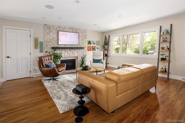 Fireplace, Interior, Living room, Recessed Lighting, Stone Walls, Wood Texture Flooring