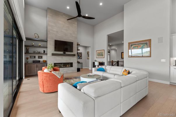 Fireplace, Interior, Living room, Recessed Lighting, Stone Walls, Wood Texture Flooring