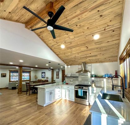 Dining room, Interior, Kitchen, Pendant Lights, Recessed Lighting, Stainless Steel Appliances, Wooden Ceilings, Wood Texture Flooring