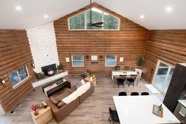 Dining room, Fireplace, Interior, Living room, Recessed Lighting, Wood Texture Flooring, Wooden Walls