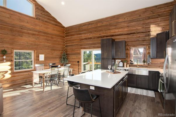 Dining room, Interior, Kitchen, Recessed Lighting, Stainless Steel Appliances, Wood Texture Flooring, Wooden Walls