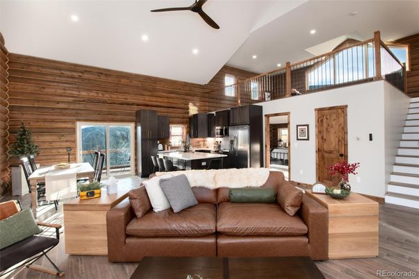 Dining room, Interior, Kitchen, Living room, Recessed Lighting, Stainless Steel Appliances, Wood Texture Flooring, Wooden Walls