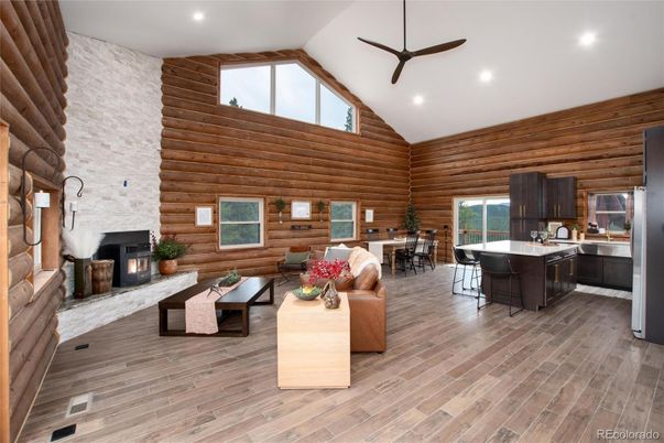 Dining room, Fireplace, Interior, Kitchen, Living room, Recessed Lighting, Stone Walls, Wood Texture Flooring, Wooden Walls