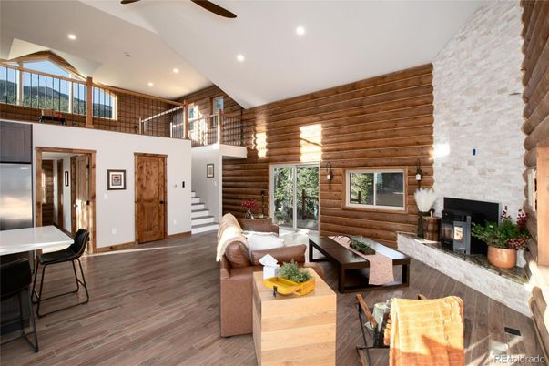Fireplace, Interior, Living room, Recessed Lighting, Stone Walls, Wood Texture Flooring, Wooden Walls