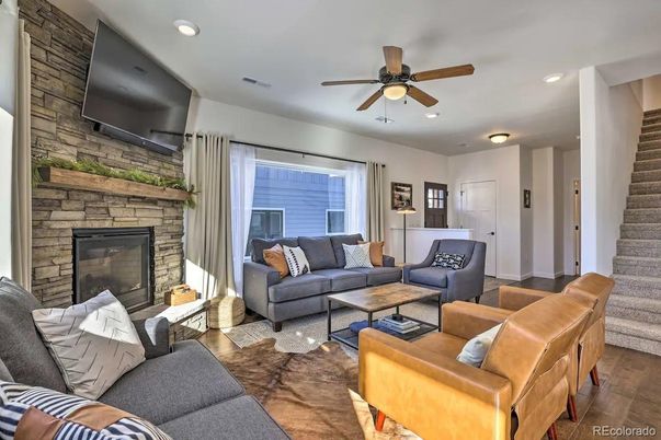 Fireplace, Interior, Living room, Recessed Lighting, Stone Walls, Wood Texture Flooring
