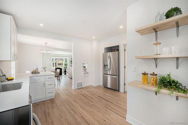 Dining room, Interior, Kitchen, Pendant Lights, Recessed Lighting, Stainless Steel Appliances, Wood Texture Flooring