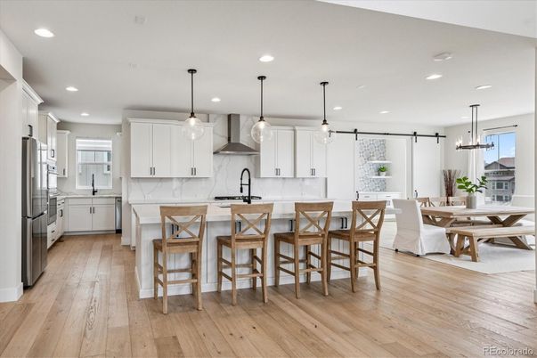 Dining room, Interior, Kitchen, Pendant Lights, Recessed Lighting, Stainless Steel Appliances, Wood Texture Flooring