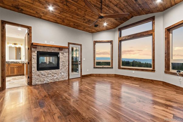 Empty room, Fireplace, Interior, Recessed Lighting, Water, Wooden Ceilings, Wood Texture Flooring
