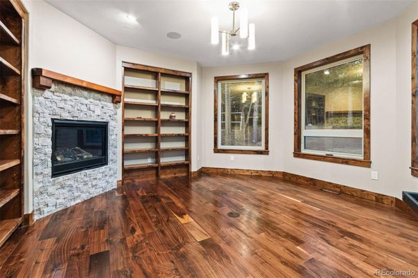 Empty room, Fireplace, Interior, Pendant Lights, Recessed Lighting, Wood Texture Flooring