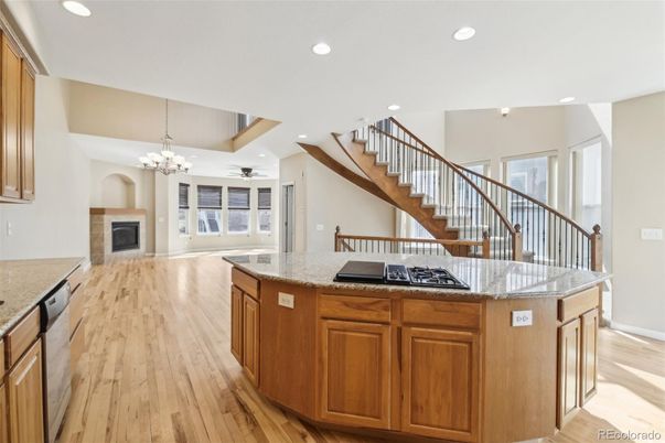 Chandelier, Fireplace, Interior, Kitchen, Recessed Lighting, Wood Texture Flooring