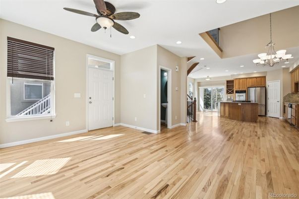 Chandelier, Empty room, Interior, Kitchen, Recessed Lighting, Stainless Steel Appliances, Wood Texture Flooring