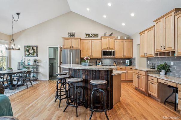 Dining room, Interior, Kitchen, Pendant Lights, Recessed Lighting, Stainless Steel Appliances, Wood Texture Flooring