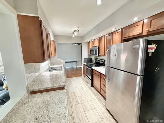Dining room, Interior, Kitchen, Recessed Lighting, Stainless Steel Appliances, Wood Texture Flooring