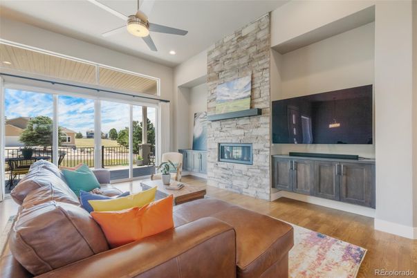 Fireplace, Interior, Living room, Recessed Lighting, Stone Walls, Wood Texture Flooring