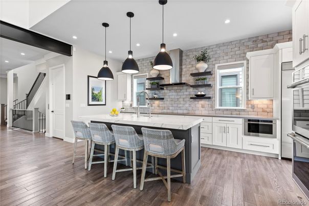 Interior, Kitchen, Pendant Lights, Recessed Lighting, Stainless Steel Appliances, Stone Walls, Wood Texture Flooring
