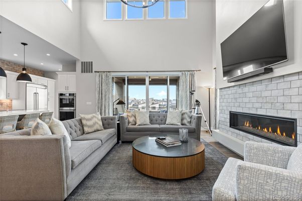 Fireplace, Interior, Kitchen, Living room, Pendant Lights, Recessed Lighting, Stainless Steel Appliances, Stone Walls