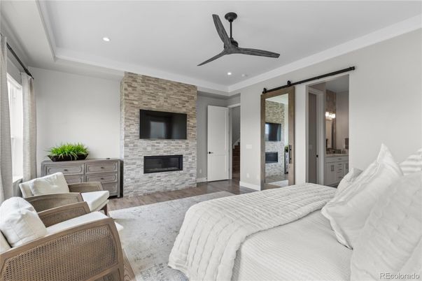Bedroom, Fireplace, Interior, Recessed Lighting, Stone Walls, Wood Texture Flooring